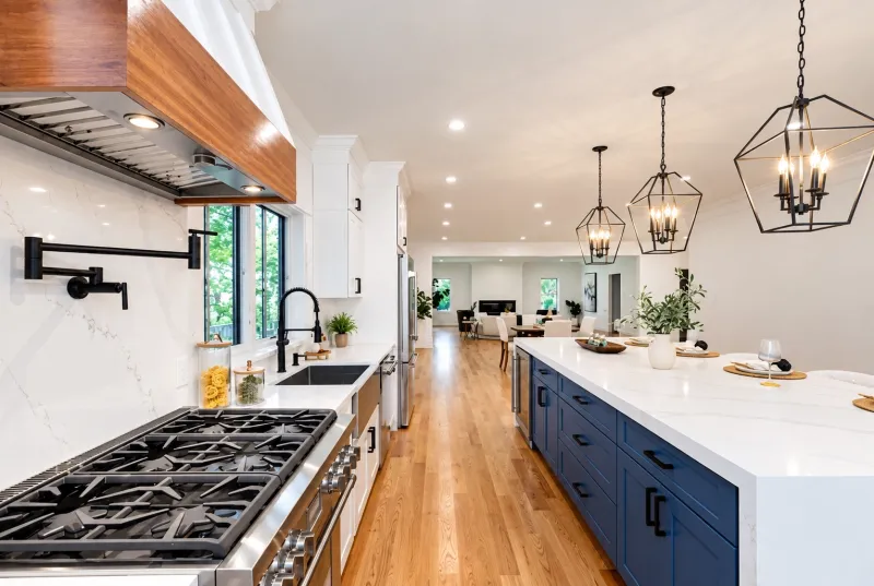 White kitchen with navy island